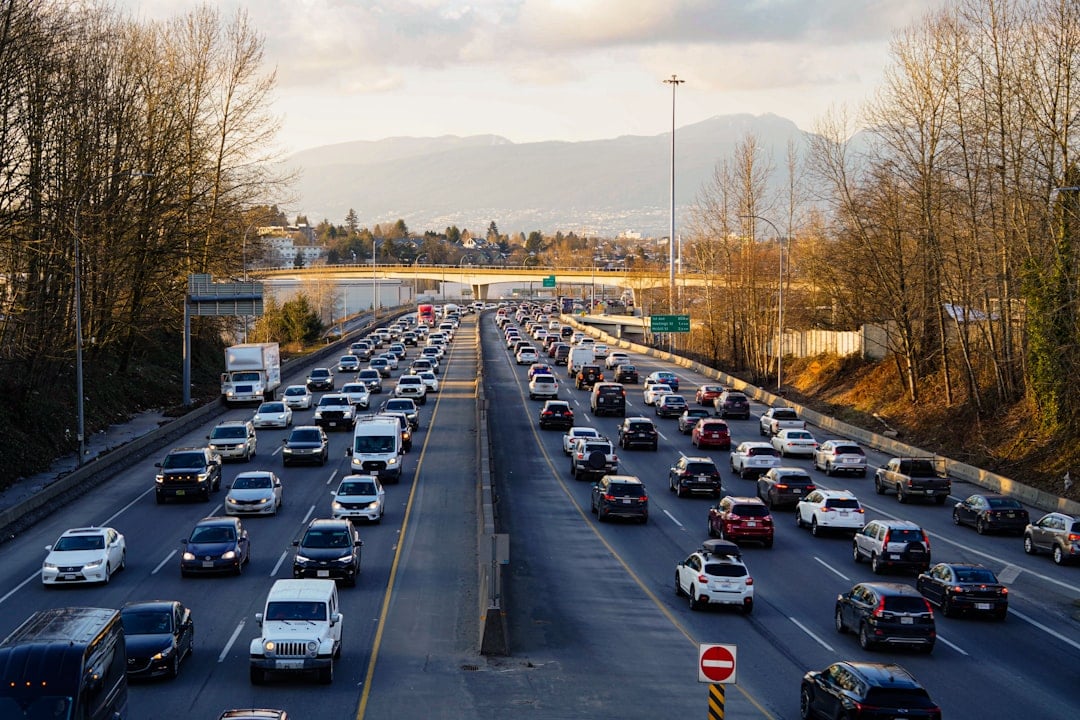 Highway is experiencing heavy traffic with many cars.